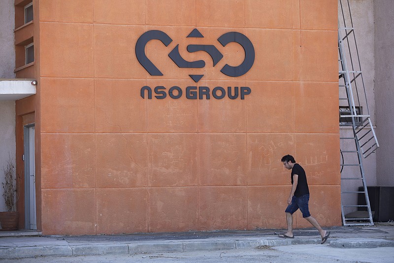 FILE - A logo adorns a wall on a branch of the Israeli NSO Group company, near the southern Israeli town of Sapir, Aug. 24, 2021. The Palestinian Foreign Ministry on Thursday, Nov. 11, 2021, said it has detected spyware developed by the Israeli hacker-for-hire company NSO Group on the phones of three senior officials and accused Israel of using the military-grade Pegasus software to eavesdrop on them. (AP Photo/Sebastian Scheiner, File)