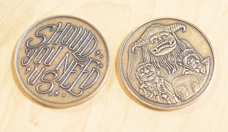 Coins commemorating the classic 1986 film Labryinth are displayed Thursday Nov. 4, 2021 at Shire Post Mint, a West Fork company that makes collectable coins and other items based on various fantasy franchises. For more information about Shirt Post Mint see https://www.shirepost.com/. Visit nwaonline.com/210001114Daily/ (NWA Democrat-Gazette/J.T. Wampler)
