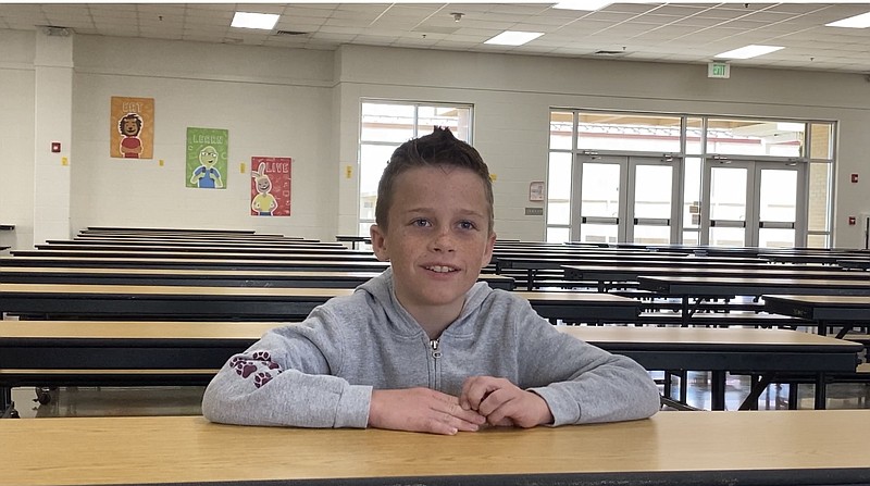 Logan Hanna, a fourth-grader at Lake Hamilton Intermediate school, is the Arkansas winner of the Bonnie Cabbage Plant program. - Photo by John Anderson of The Sentinel-Record