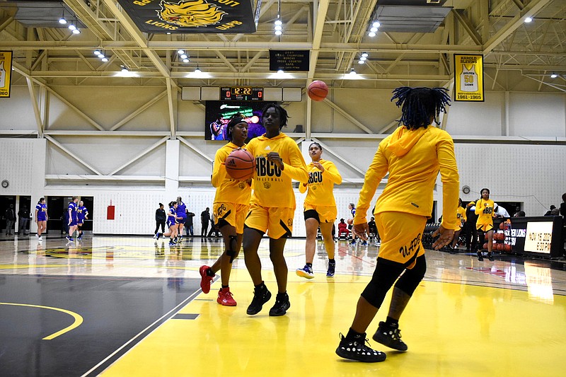 The UAPB women's basketball team warms up for a Nov. 9, 2021, season opening game against McNeese State at H.O. Clemmons Arena. (Pine Bluff Commercial/I.C. Murrell)