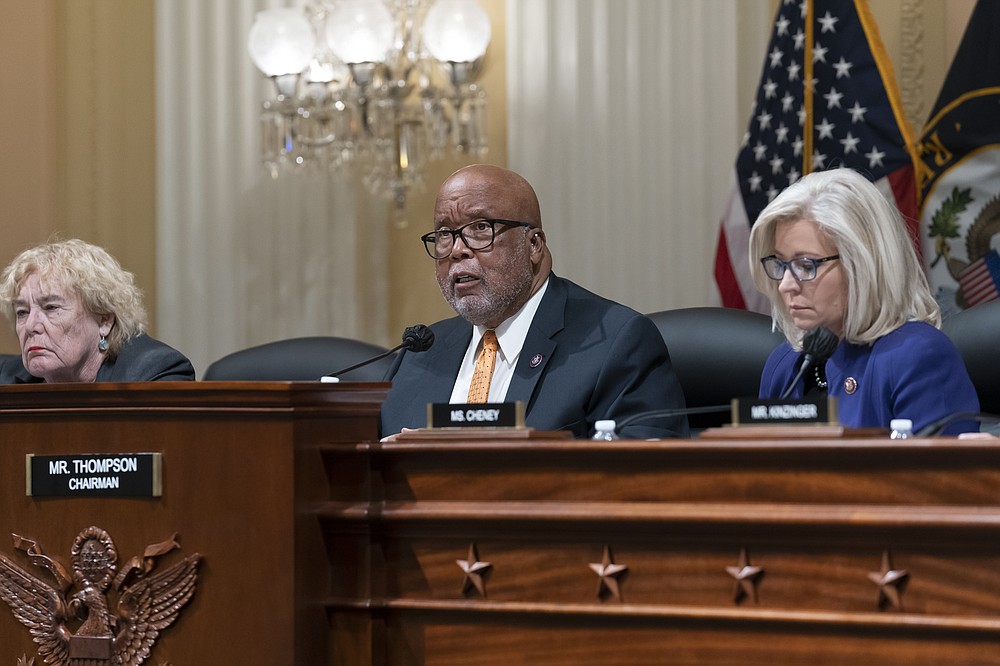 Chairman Bennie Thompson, D-Miss., flanked by Rep. Zoe Lofgren, D-Calif., left, and Vice Chair Liz Cheney, R-Wyo., speaks as the House select committee tasked with investigating the January 6th attack on the Capitol meets to hold one of former President Donald Trump's allies in contempt, former strategist Steve Bannon, on Capitol Hill in Washington, Tuesday evening, Oct. 19, 2021. (AP Photo/J. Scott Applewhite)