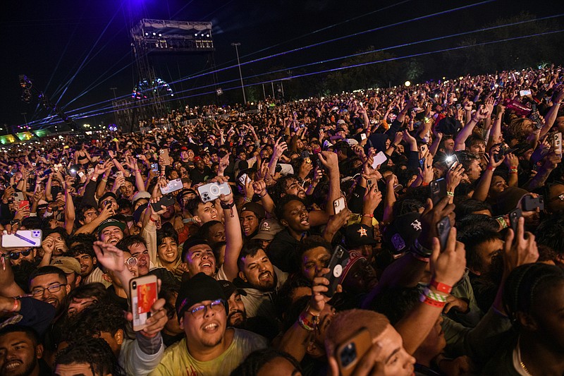 FILE - The crowd watches as Travis Scott performs at Astroworld Festival at NRG park on Friday, Nov. 5, 2021 in Houston. (Jamaal Ellis/Houston Chronicle via AP, File)