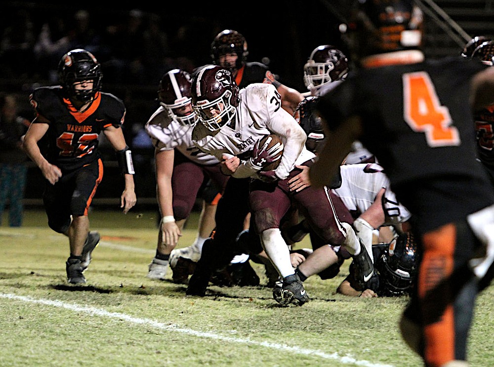 Submitted/NIKKI SLONE RAYBURN-STILL
Gentry senior Will Pyburn breaks through the line on a running play during Friday's playoff game at Lamar High School.