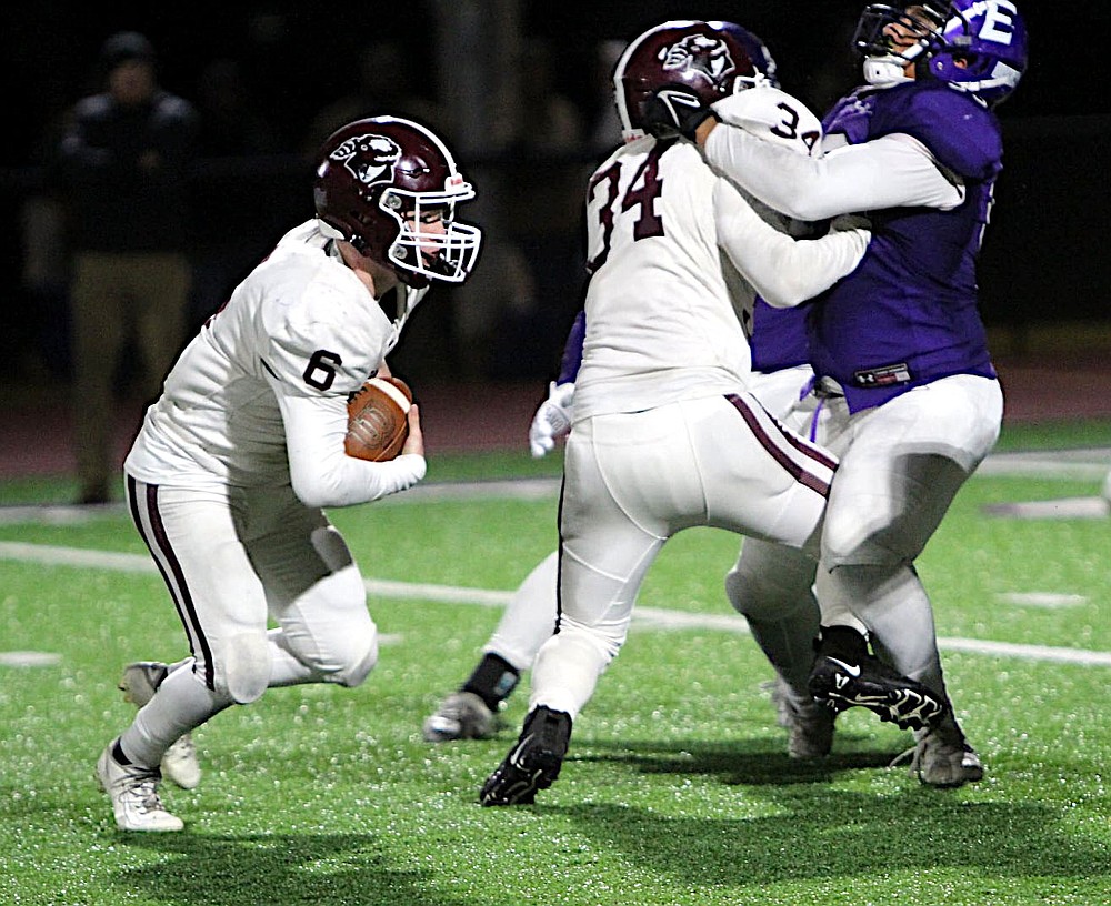 Submitted/NIKKI SLONE RAYBURN-STILL
Behind the blocking of Will Pyburn, Gentry junior Ty Hays runs the ball during Friday's playoff game at Lamar High School.