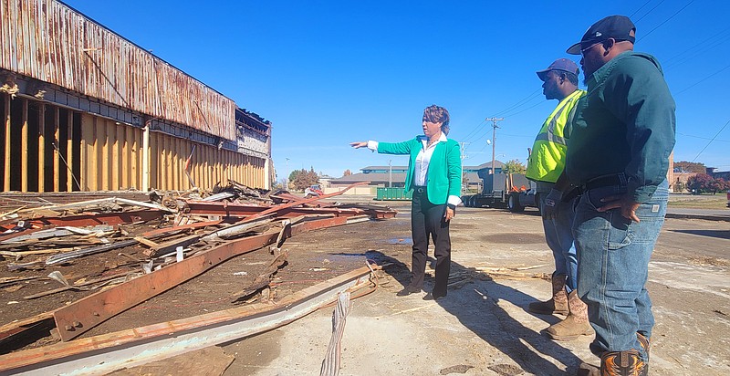 The interim executive director for the Pine Bluff Urban Renewal, Chandra Griffin, gives directions to team members Frederick Hawkins and Terrance Williams during the demolishing of the old Bingo Hall on Monday. (Not pictured are team members William Eves and Terence Mitchner) (Pine Bluff Commercial/Eplunus Colvin)