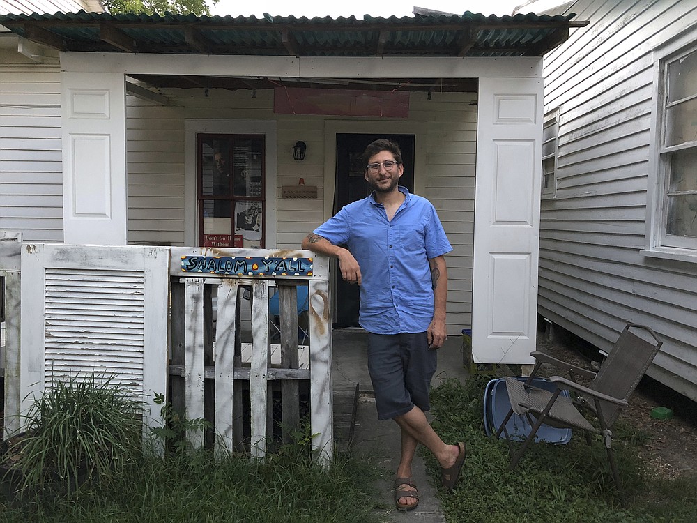 FILE - This photo provided by the family courtesy shows Danny Fenster posing for a photo in front of his home in Lafayette, La., in 2018. Fenster, sentenced only days ago to 11 years hard labor in Myanmar, has been freed and is on his way home, former U.S. Ambassador to the U.N. Bill Richardson said Monday, Nov. 15, 2021. (family courtesy photo via AP, File)