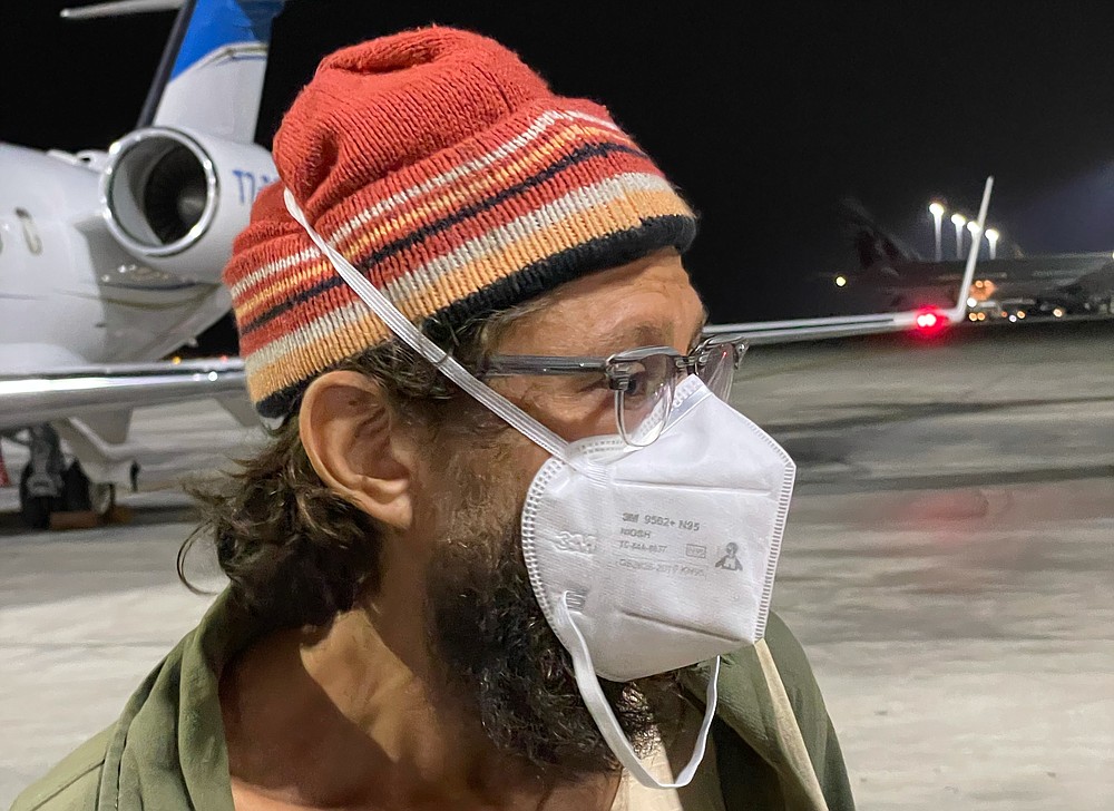 American journalist Danny Fenster, who spent nearly six months in jail in military-ruled Myanmar and was facing a sentence of 11 years of hard labor, has been freed , talks to media at Doha, Qatar airport, Monday Nov 15, 2021. (AP Photo/Luis Costa)