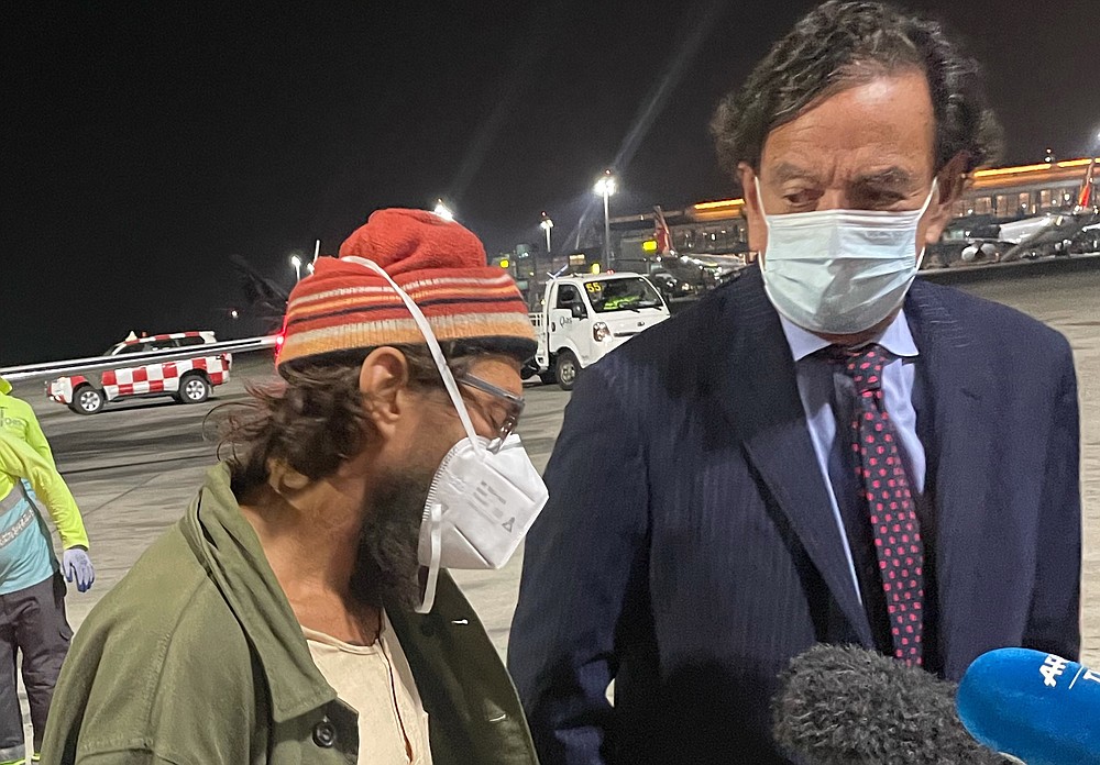 American journalist Danny Fenster, who spent nearly six months in jail in military-ruled Myanmar and was facing a sentence of 11 years of hard labor, has been freed , talks to media at Doha, Qatar airport, Monday Nov 15, 2021. U.S. On the right is diplomat Bill Richardson, who helped negotiate the release, (AP Photo/Luis Costa)