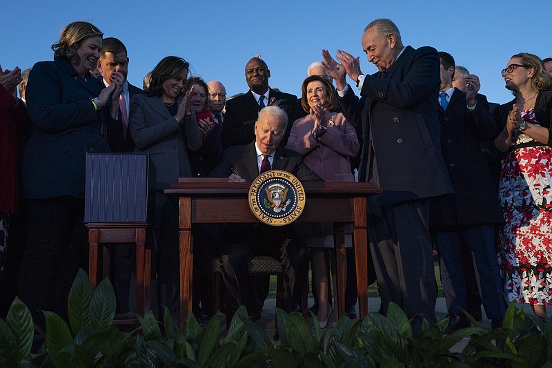 The Associated Press
President Joe Biden signs the "Infrastructure Investment and Jobs Act" during an event on the South Lawn of the White House on Monday in Washington.