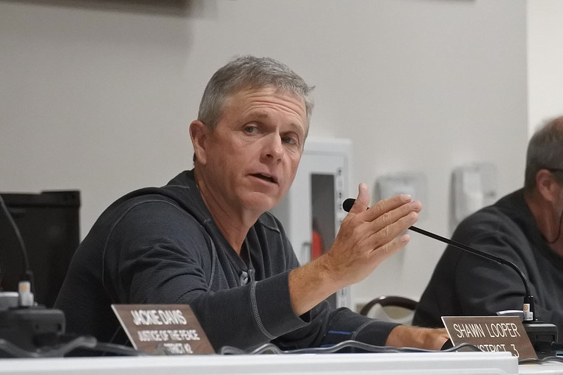 Shawn Looper, Sebastian County justice of the peace for District 3 and budget chairman, speaks during the Sebastian County Quorum Court regular meeting Tuesday. 
(NWA Democrat-Gazette/Thomas Saccente)