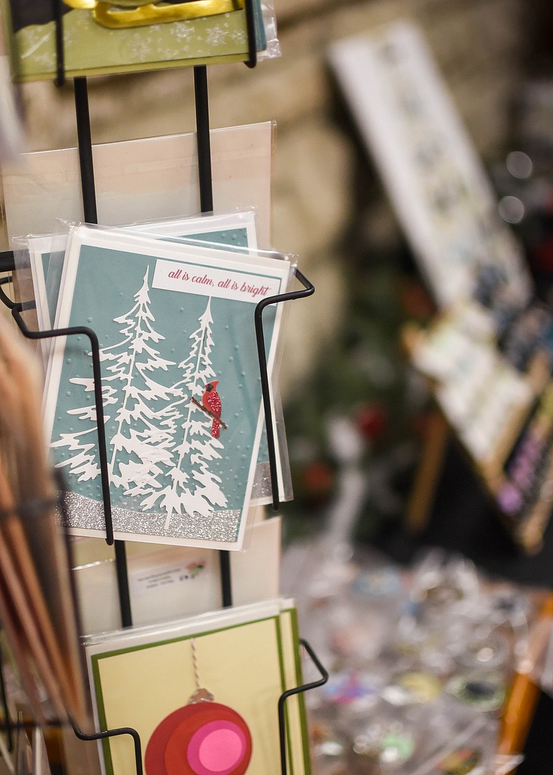 (India Garrish/News Tribune) Handmade cards by Faye Zumwalt sit Nov. 16 alongside other crafts in Capital Arts as part of the Give the Gift of Art exhibit.