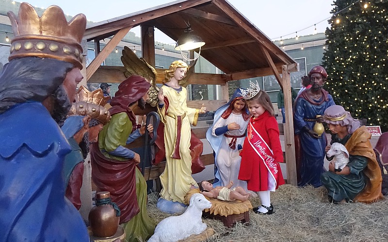 Layla Harris, 3, takes moment to see the manger scene on the Atlanta, Texas, Veterans’ Plaza. Layla earlier had won the designation of Tiny Miss Hometown Christmas Pageant winner. With relatives in Bloomburg, she’s the daughter of Tyler Harris of Texarkana.