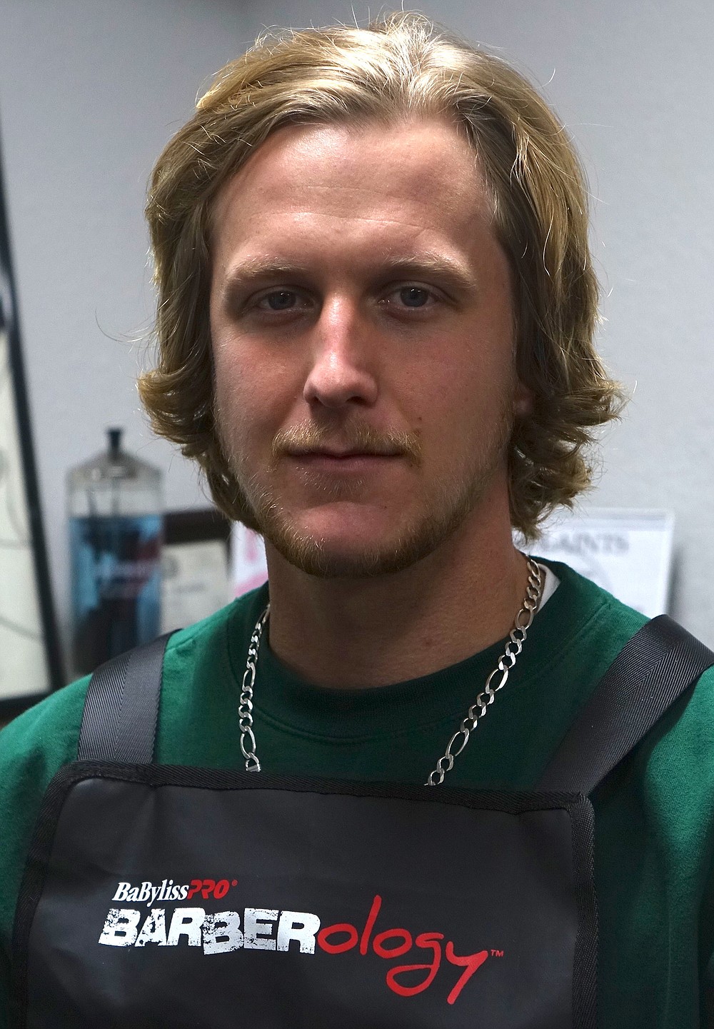 Clayton James may barber other people’s hair, but he’s currently letting his own grow long. “Part of my new personality,” the new barber says.