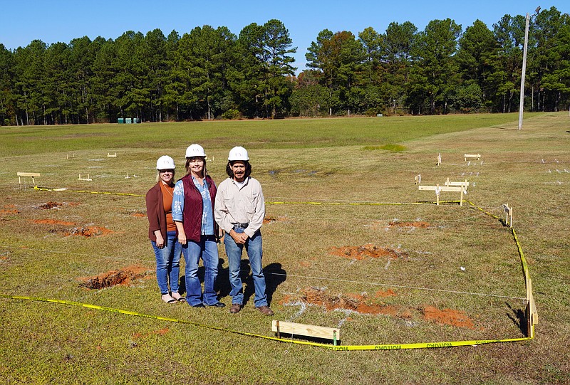 From left,  Jennifer Teresa, dean of Technical and Industrial programs; Laura Clark, vice chancellor for Academics; and Don Hollanger, Solar Technology instructor at the construction site of the solar energy technology lab on the University of Arkansas Hope campus. (Photo courtesy of Casey Curtis/UAHT)
