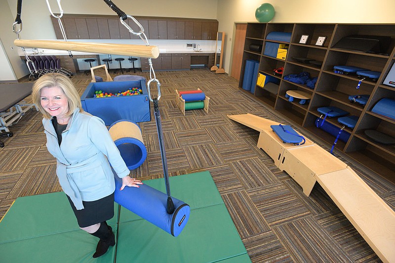 Jennifer Moore, dean of the Arkansas Colleges of Health Education School of Occupational Therapy, demonstrates on Tuesday, Nov. 23, 2021, various tools in a new specialty classroom called the Live and Learn Lab to be used by students when an inaugural three-year program for occupational therapy begins its first class in January 2022. The ACHE will host a ribbon-cutting and dedication for its new College of Health Sciences building on Dec. 6. Go to nwaonline.com/211128Daily/ to see more photos.
(NWA Democrat-Gazette/Hank Layton)