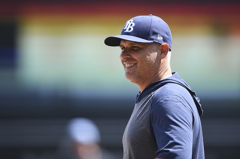 FILE - Tampa Bay Rays manager Kevin Cash watches players before the team's baseball game against the Baltimore Orioles on Aug. 8, 2021, in Baltimore. Cash won the American League Manager of the Year award Tuesday night, Nov. 16. (AP Photo/Terrance Williams, File)
