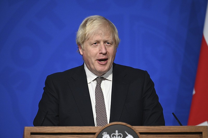 Britain's Prime Minister Boris Johnson addresses the media regarding Britain's COVID-19 infection rate and vaccination campaign, in Downing Street, London, Monday Nov. 15, 2021. (Leon Neal/Pool via AP)