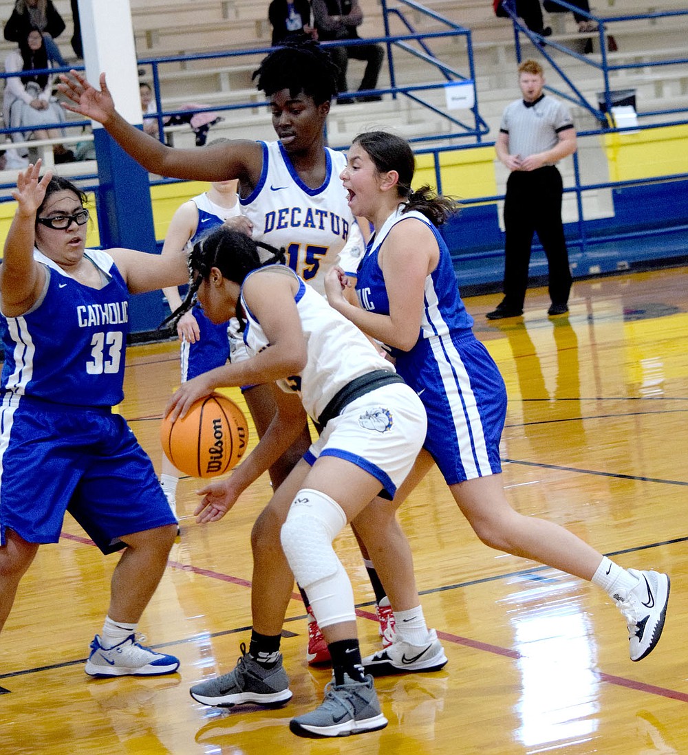 Westside Eagle Observer/MIKE ECKELS
Lady Bulldog Kadidiatou Barry (15) tries to open up a hole for team mate Naomi Jimenez (13) during the second quarter of the Decatur-Ozark Catholic girls basketball contest at Peterson Gym in Decatur Saturday afternoon. The Lady Bulldogs and Lady Griffins were part of the second place round of the Decatur Invitational Basketball tournament.