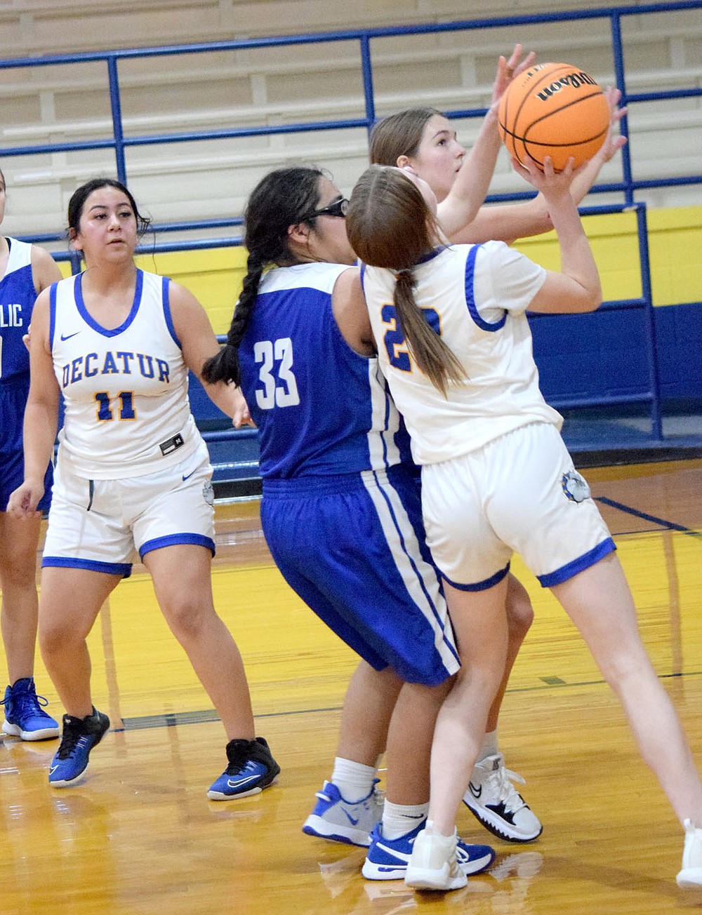 Westside Eagle Observer/MIKE ECKELS
Brooklyn Todd (Decatur 23) tries to put up a jumper from the right side of the lane during the third quarter of the Decatur-Ozark Catholic girls basketball contest in Decatur Saturday afternoon.