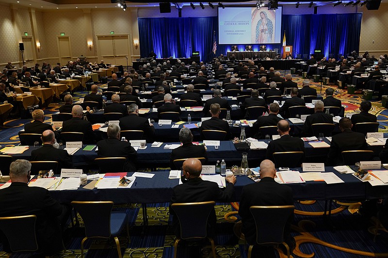 Clergy attend the Fall General Assembly meeting of the United States Conference of Catholic Bishops, Wednesday, Nov. 17, 2021, in Baltimore.(AP Photo/Julio Cortez)