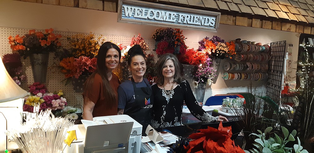 The Ladies of Hart & # x27; s on Broad, three businesses in one, welcome their visiting customers to the downtown shopping district.  Debbie Liles, right, owns Let There Be Design Gifts, Natalie Liles runs the NaTally salon, and Chelley Pickett owns Bones & Arrow.