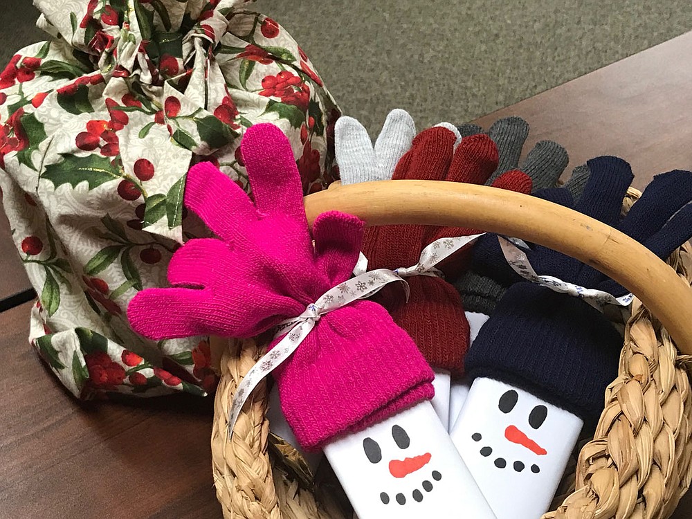 Crafts for Christmas giving this year include candy bars packaged with a pair of gloves.
(NWA Democrat-Gazette/Becca Martin-Brown)