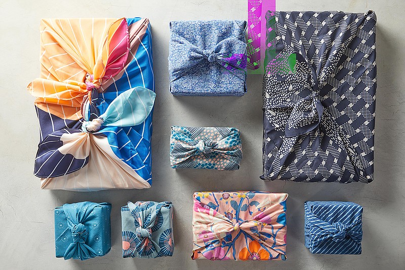 Fabric-wrapped gifts are an alternative to traditional gift wrap. (Jacob Fox/Better Homes & Gardens via AP)