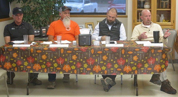 Westside Eagle Observer/SUSAN HOLLAND
Panel participants listen as Jeff Hendren, owner of H&K Heating & Air (right), makes a point at the Nov. 17 meeting of the Greater Gravette Chamber of Commerce. Business owners from area construction trades businesses who participated in the panel discussion included Rocky Barker, of Heartland Electric; Ruben Bass, of Bassman Plumbing; Chris Flynt, of Built-Well Construction; and Hendren.