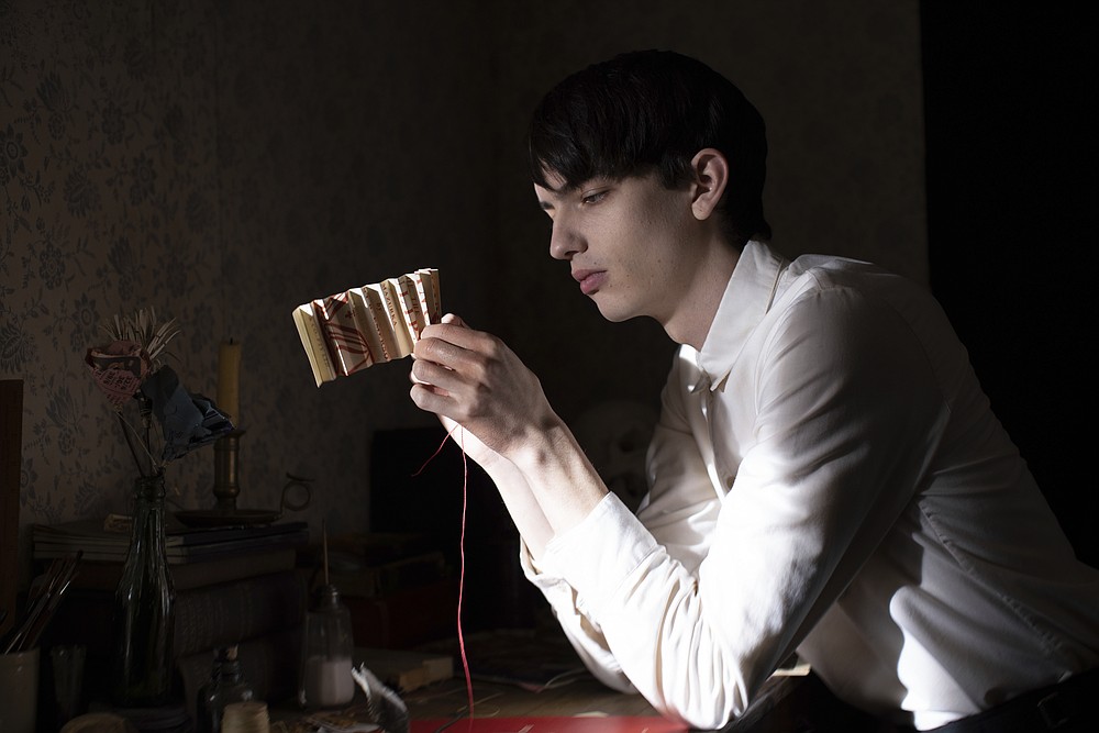 This image released by Netflix shows Kodi Smit-McPhee in a scene from "The Power of the Dog" (Netflix via AP)