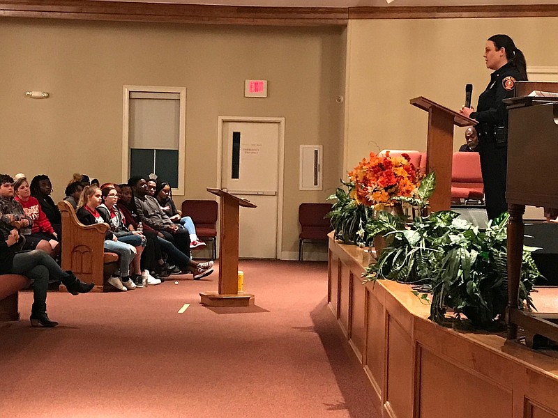 Texarkana, Arkansas, Police Chief Kristie Bennett speaks to a group gathered at the Church of the Living God No.4 during a community forum Thursday evening. The forum focused on a recent surge of youth violence in the Texarkana area. (Staff Photo By Greg Bischof)
