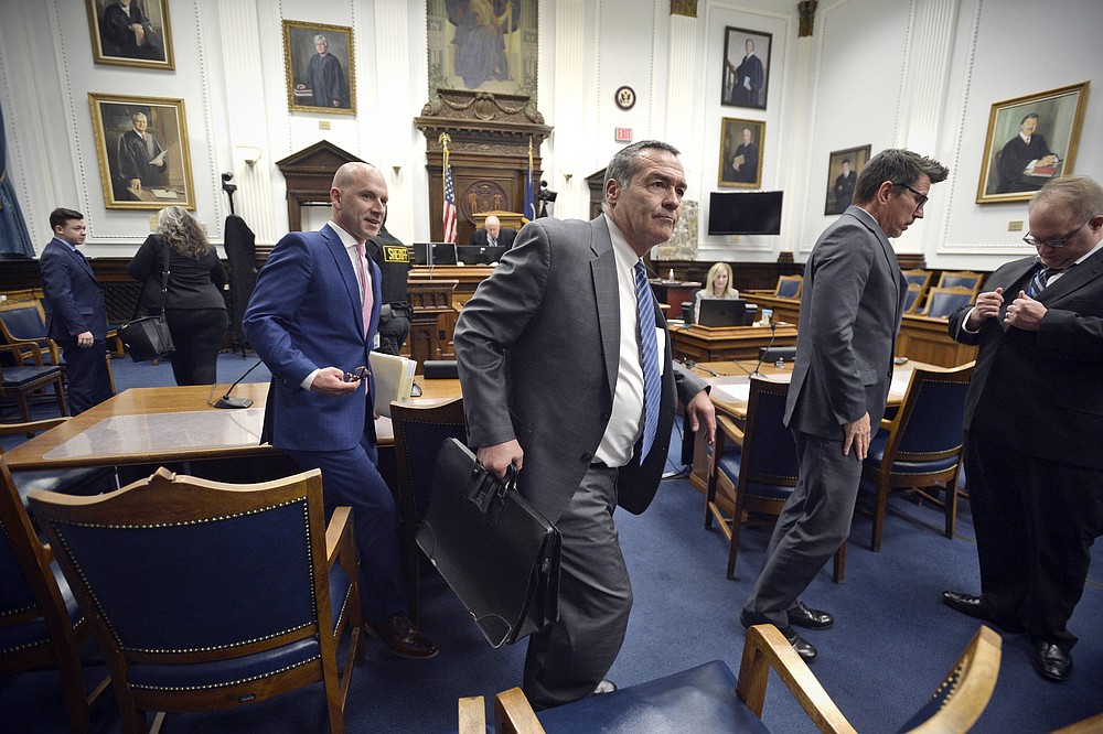 Kyle Rittenhouse, left, along with all of the attorneys in the case make their way out of the courtroom after the jury was relieved for the day at the Kenosha County Courthouse in Kenosha, Wis., on Thursday, Nov. 18, 2021. (Sean Krajacic/The Kenosha News via AP, Pool)