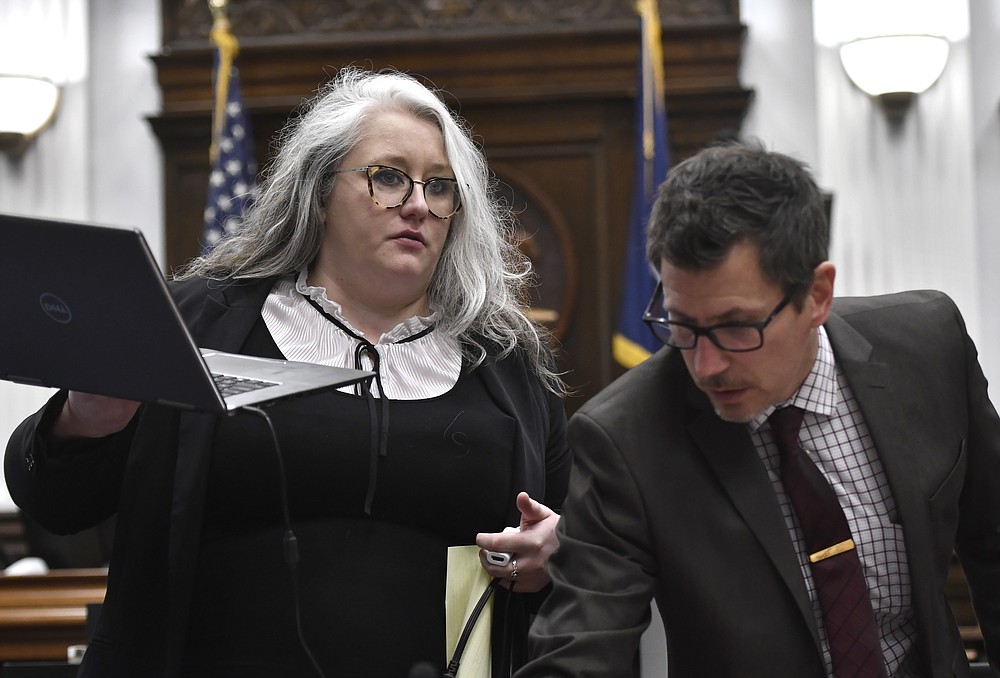 Natalie Wisco, an attorney for Kyle Rittenhouse, left, and Assistant District Attorney Thomas Binger get video ready that was requested by the jury for deliberations during Rittenhouse's trial at the Kenosha County Courthouse in Kenosha, Wis., on Wednesday, Nov. 17, 2021. (Sean Krajacic/The Kenosha News via AP, Pool)