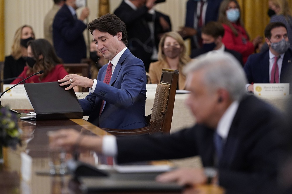 President Joe Biden meets with Mexican President Andrés Manuel López Obrador, right, and Canadian Prime Minister Justin Trudeau in the East Room of the White House in Washington, Thursday, Nov. 18, 2021. (AP Photo/Susan Walsh)