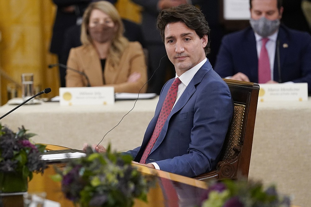Canadian Prime Minister Justin Trudeau listens as he meets with President Joe Biden and Mexican President Andrés Manuel López Obrador in the East Room of the White House in Washington, Thursday, Nov. 18, 2021. (AP Photo/Susan Walsh)