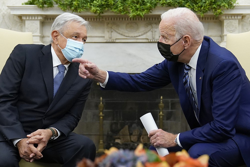 President Joe Biden meets with Mexican President Andrés Manuel López Obrador in the Oval Office of the White House in Washington, Thursday, Nov. 18, 2021. (AP Photo/Susan Walsh)