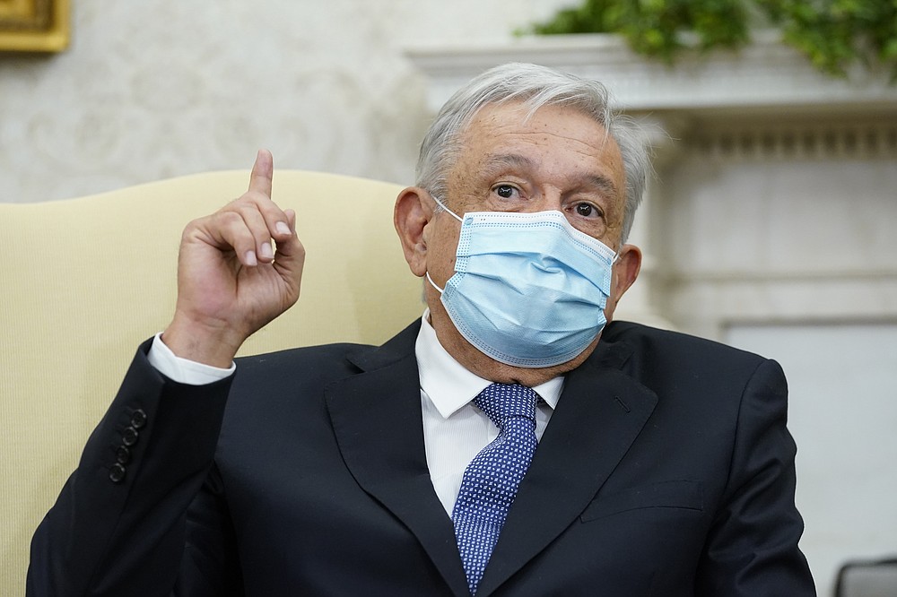 Mexican President Andrés Manuel López Obrador speaks during a meeting with President Joe Biden in the Oval Office of the White House in Washington, Thursday, Nov. 18, 2021. (AP Photo/Susan Walsh)