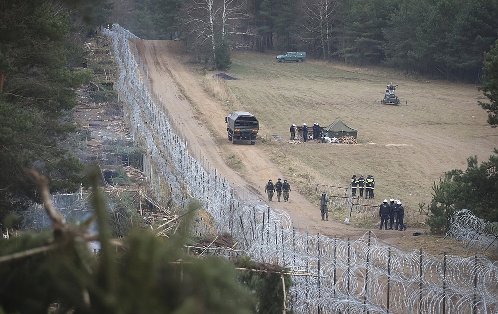 A general view of a deserted migrants' camp near the checkpoint "Kuznitsa" at the Belarus-Poland border near Grodno, Belarus, on Thursday, Nov. 18, 2021. A plane carrying migrants back to Iraq is due to leave the Belarusian capital Minsk on Thursday, part of efforts by the Iraqi authorities to help citizens to have been stranded at the border between Belarus and Poland in the hope of getting into the European Union. Spokesman of the Iraqi Foreign Minister Ahmed Al Sahhaf said Thursday that at least 430 people have registered to return to Iraq from Belarus, and the authorities were in process of registering 50 more. (Leonid Shcheglov/BelTA via AP)