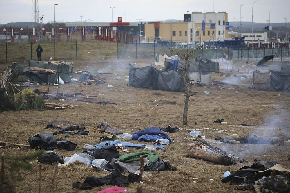 A general view of a deserted migrants' camp near the checkpoint "Kuznitsa" at the Belarus-Poland border near Grodno, Belarus, on Thursday, Nov. 18, 2021. A plane carrying migrants back to Iraq is due to leave the Belarusian capital Minsk on Thursday, part of efforts by the Iraqi authorities to help citizens to have been stranded at the border between Belarus and Poland in the hope of getting into the European Union. Spokesman of the Iraqi Foreign Minister Ahmed Al Sahhaf said Thursday that at least 430 people have registered to return to Iraq from Belarus, and the authorities were in process of registering 50 more. (Leonid Shcheglov/BelTA via AP)