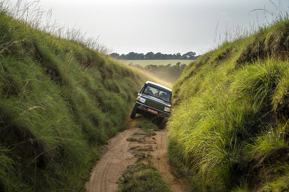 Park rangers drive through Gabon's Pongara National Park forest, on March 12, 2020. Gabon holds about 95,000 African forest elephants, according to results of a survey by the Wildlife Conservation Society and the National Agency for National Parks of Gabon, using DNA extracted from dung. Previous estimates put the population at between 50,000 and 60,000 or about 60% of remaining African forest elephants. (AP Photo/Jerome Delay)