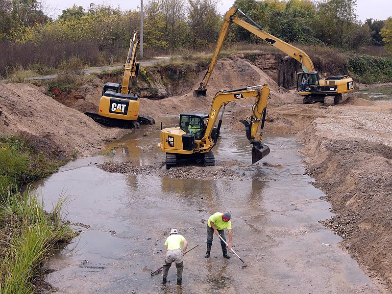 In this undated photo provided by the city of Texarkana, Arkansas, a crew works clearing sediment deposits in Nix Creek. The work being done is the result of an engineering study funded by the city Board of Directors. (Submitted photo)