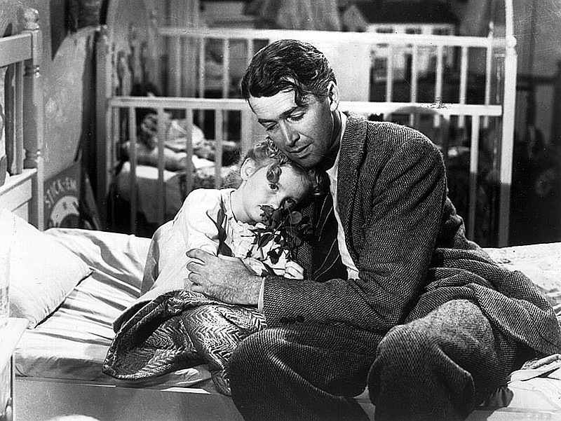 James Stewart as George Bailey, hugs actor Karolyn Grimes, who plays his daughter Zuzu, in a still from &quot;It&apos;s a Wonderful Life.&quot; (Hulton Archive/Getty Images/TNS)