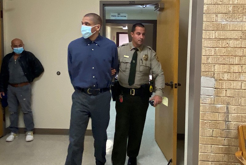 NWA Democrat-Gazette/TRACY NEAL A Benton County sheriff's deputy leads Corey Glenn out of the courtroom following his convictions on trafficking of persons and other charges Friday, Nov. 19, 2021.