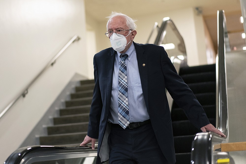 Sen. Bernie Sanders, I-Vt., takes the escalator to the subway on Capitol Hill in Washington, Thursday, Nov. 4, 2021. (AP Photo/Carolyn Kaster)