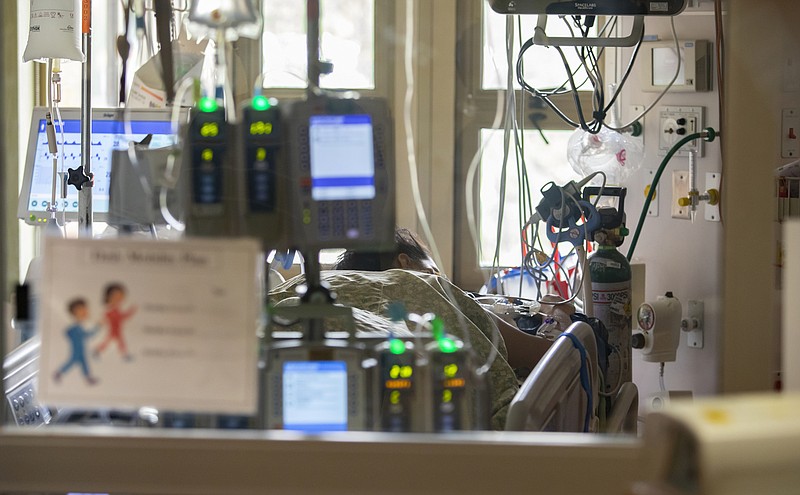 FILE - A pregnant and intubated COVID-19 patient sits in the Surgical Intensive care unit (SICU) at St. Luke's Boise Medical Center in Boise, Idaho on Tuesday, Aug. 31, 2021.  Pregnant women with COVID face increased chances for stillbirths and that risk spikes to four times higher with the delta variant compared with uninfected women, new CDC data show.   (AP Photo/Kyle Green, File)