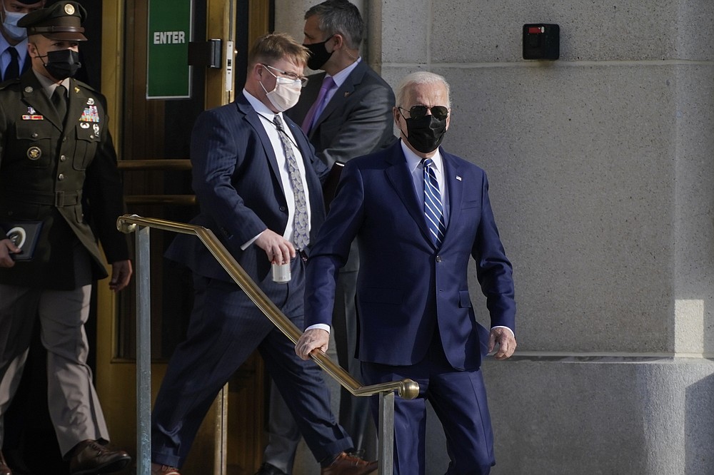 President Joe Biden walks out of the Walter Reed National Military Medical Center after a physical exam, Friday, Nov. 19, 2021, in Bethesda, Md. (AP Photo/Evan Vucci)