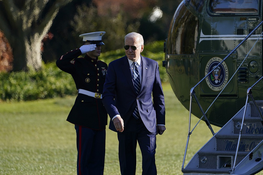 President Joe Biden walks off of Marine One on the South Lawn of the White House in Washington, Friday, Nov. 19, 2021, after returning from Walter Reed National Military Medical Center for his annual physical. (AP Photo/Susan Walsh)