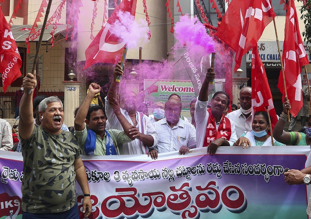 Activists of various organizations celebrate news of the repeal of farm laws they were protesting against in Hyderabad, India, Friday, Nov. 19, 2021. In a surprise announcement, India&#x27;s Prime Minister Narendra Modi said Friday his government will withdraw the controversial agriculture laws that prompted yearlong protests from tens of thousands of farmers and posed a significant political challenge to his administration. (AP Photo/Mahesh Kumar A.)