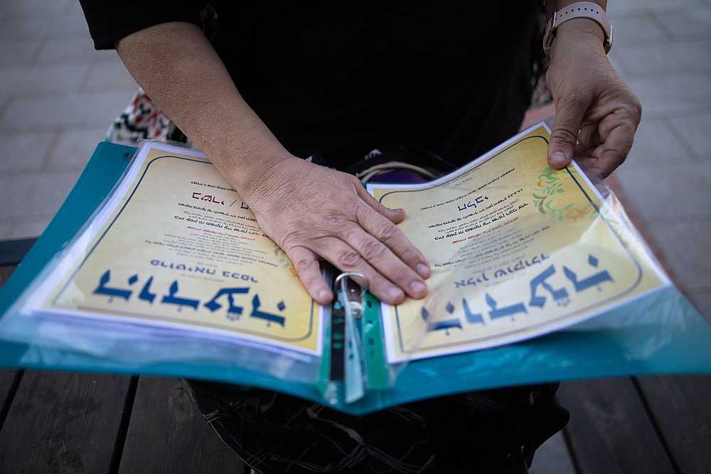 Sara Meckler, 61, Kashrut supervisor for the Israeli organization Tzohar, holds a folder with Kosher certificates ready for delivery to the respective businesses. MUST CREDIT: Photo for The Washington Post by Corinna Kern