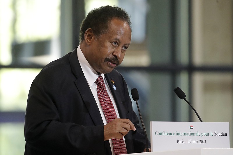 FILE - Sudanese Prime Minister Abdalla Hamdok speaks during a session of the summit to support Sudan, May 17, 2021 at the Grand Palais Ephemere in Paris. On Sunday, Nov. 21, 2021, Sudan&#x2019;s military and civilian leaders signed a deal to reinstate Prime Minister Abdalla Hamdok, who was deposed in a coup last month. According to the deal, the military will also release government officials and politicians arrested since the Oct. 25 coup. The country&#x2019;s top general, Abdel Fattah Burhan, said Hamdok will lead an independent technocratic Cabinet until elections can be held. (AP Photo/Christophe Ena, Pool, File)