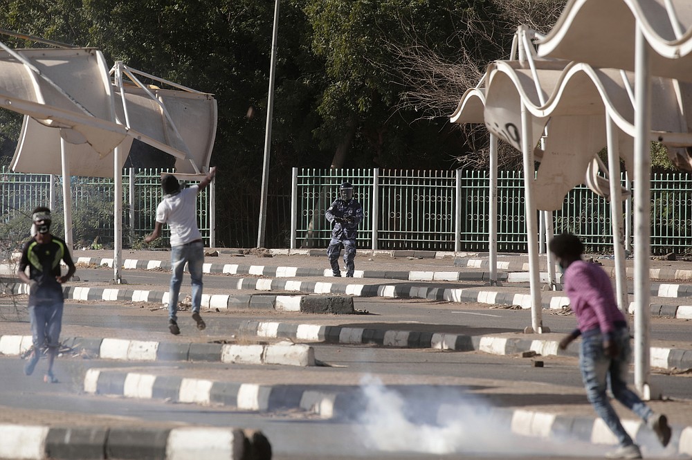 Sudanese protest against the military takeover, which upended the country’s fragile transition to democracy, in Khartoum, Sudan, Sunday, Nov. 21, 2021. Sudan’s military and civilian leaders signed a deal Sunday to reinstate Prime Minister Abdalla Hamdok, who was deposed in a coup last month. The country’s top general, Abdel Fattah Burhan, said in televised statements that Hamdok will lead an independent technocratic Cabinet until elections can be held. (AP Photo/Marwan Ali)